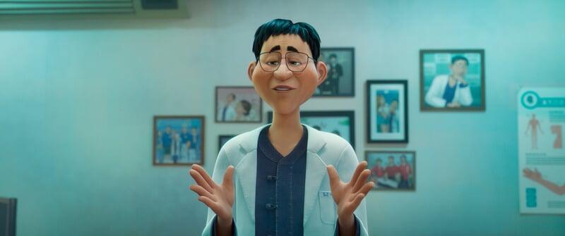 A stylized animated character, a male Asian doctor wearing glasses and a light teal lab coat over a dark blue top, stands in a doctor's office. His hands are open in a welcoming or explanatory gesture. The walls of the office are a light teal and feature several framed photographs of people, possibly colleagues or family, and a medical chart depicting the human anatomy